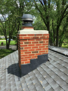masonry chimney with metal cap