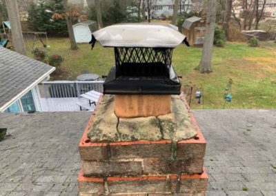 Chimney Crown Deteriorated and Masonry Chimney has Discoloration and Missing Mortar Joints