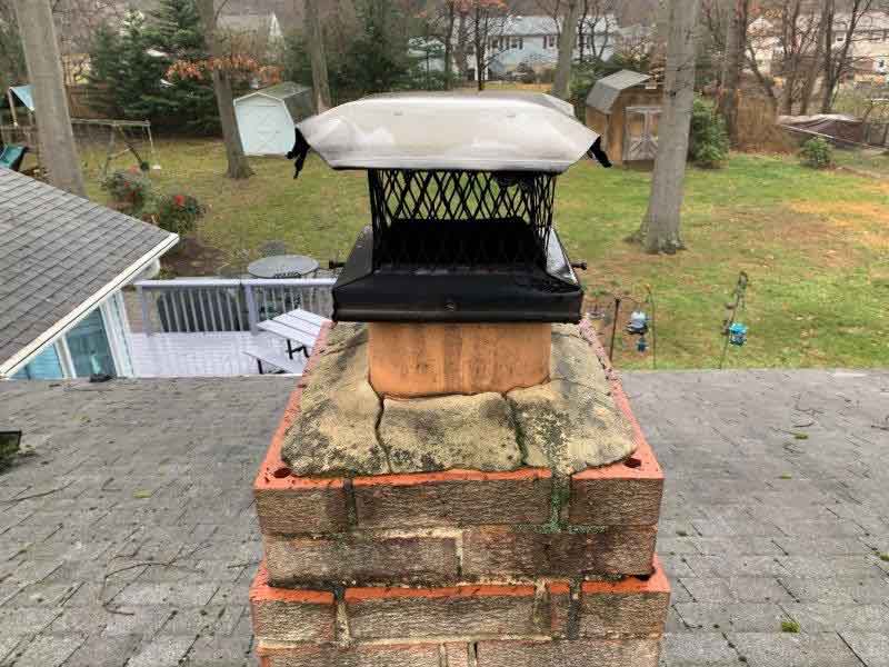 Chimney Crown Deteriorated and Masonry Chimney has Discoloration and Missing Mortar Joints