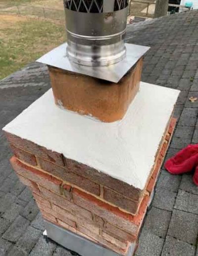 Resurfaced Chimney Crown and Masonry Brick Free of Discoloration and Vegetation